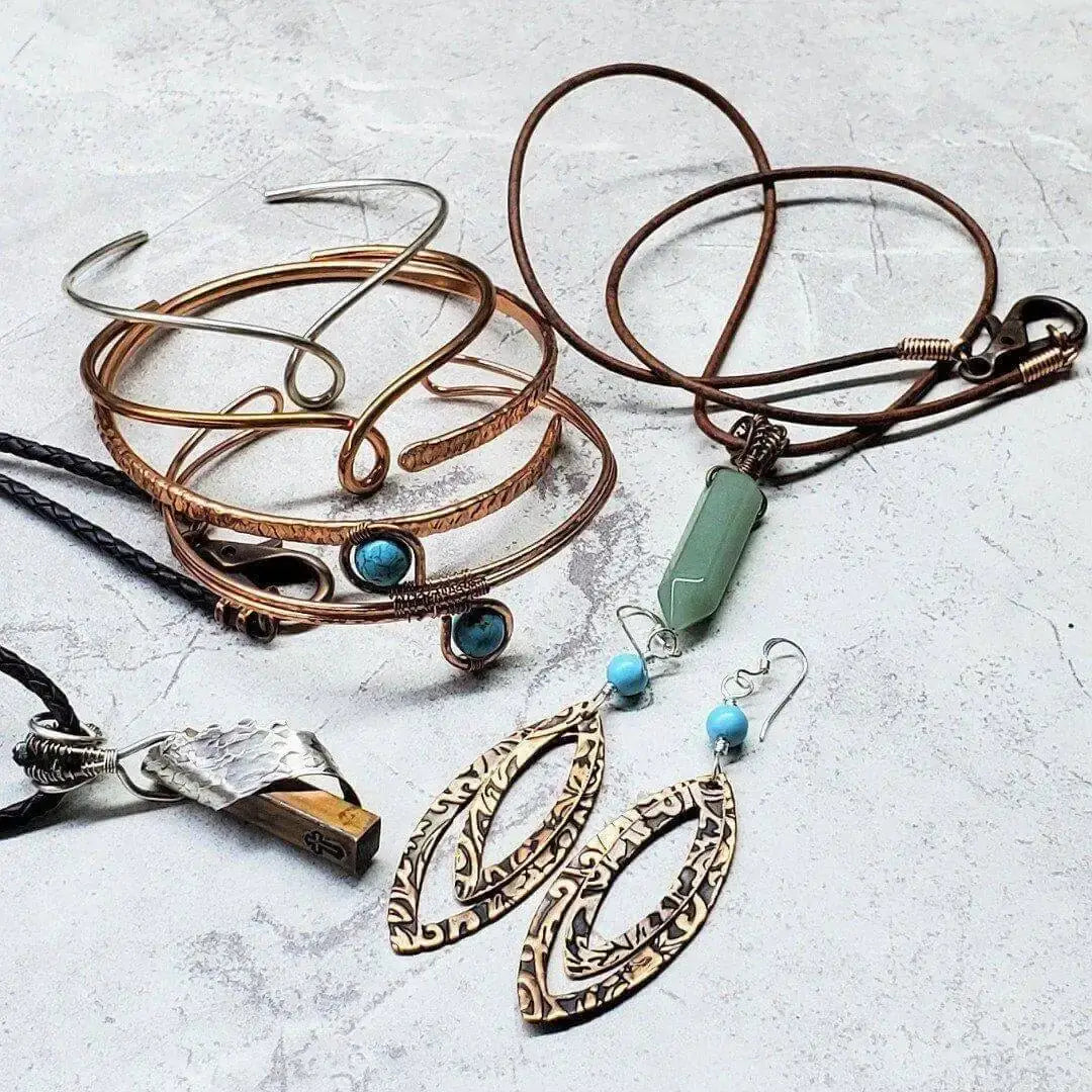 Copper and Silver Jewelry Care from Alexa Martha Designs featuring bracelets, necklaces, and earrings on a light background.
