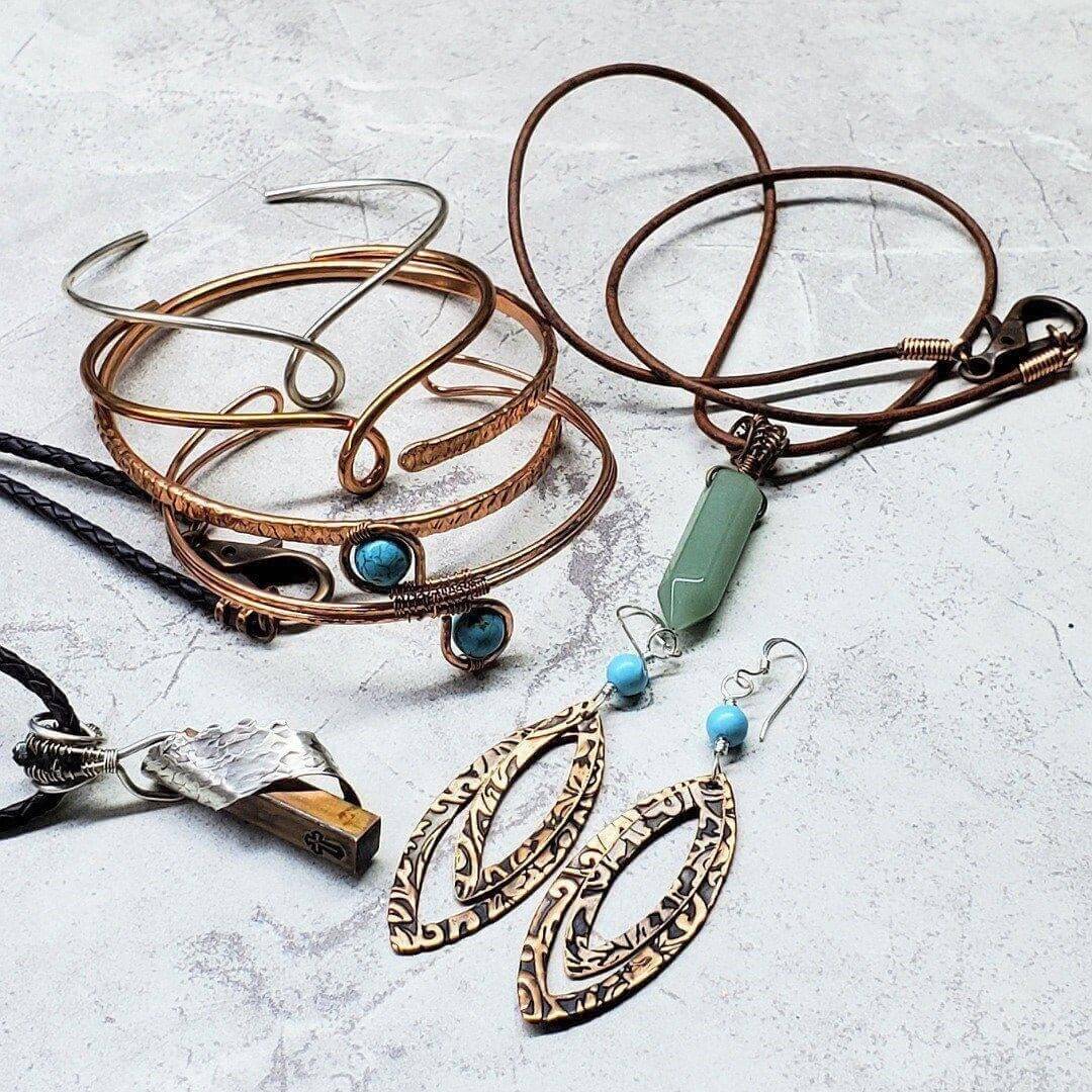 Copper and Silver Jewelry Care from Alexa Martha Designs featuring bracelets, necklaces, and earrings on a light background.