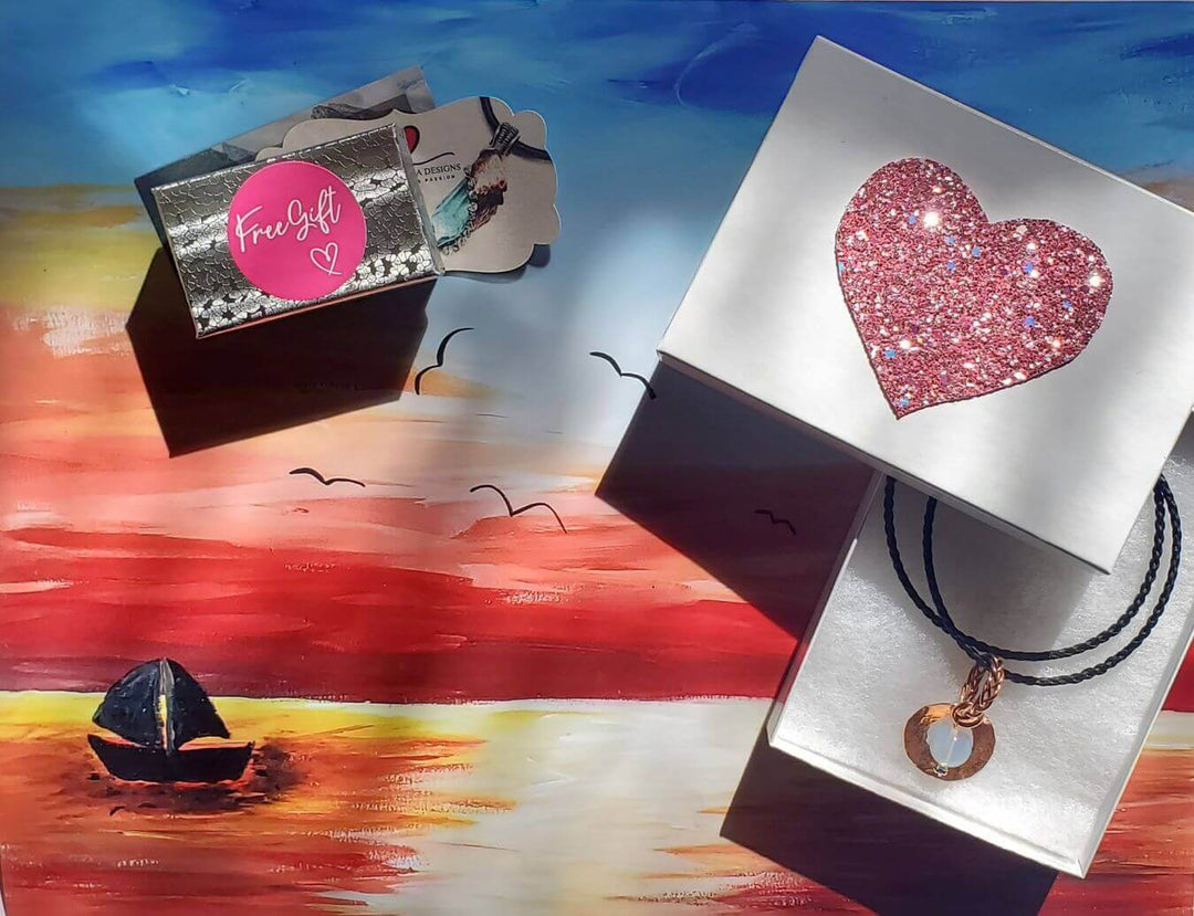 Did you get all your Christmas Shopping Done? Gifts including jewelry on a colorful sunset backdrop.