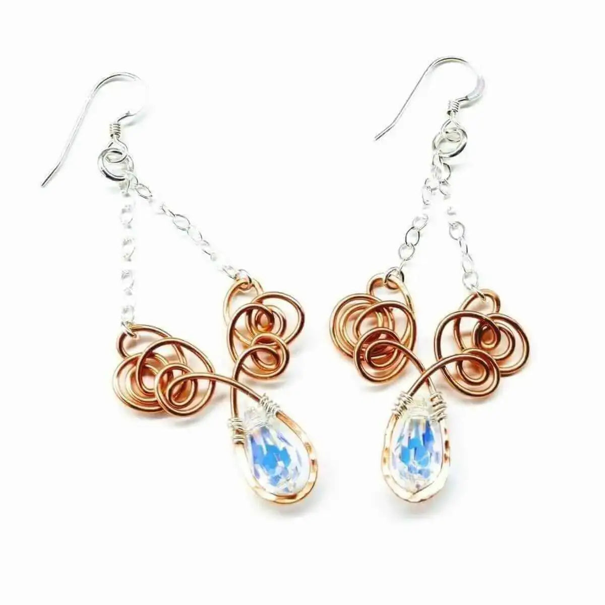 Discover the art of wire sculpting with these handmade wire earrings featuring elegant crystals.