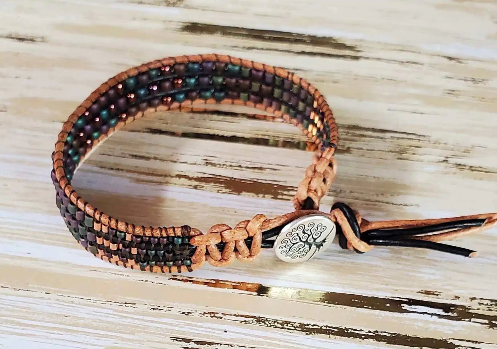Men's Tree of Life Bracelet showcasing intricate beading and a silver tree charm.