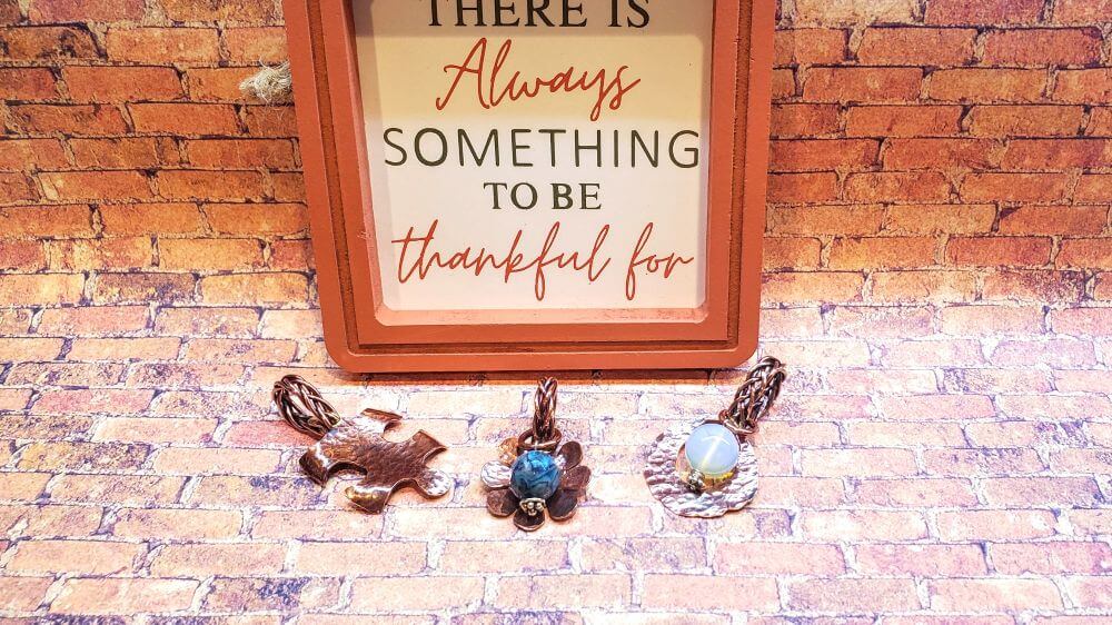 Metal Braided Large Bail Pendants with Optional Necklace displayed on a rustic background with a thankfulness sign.