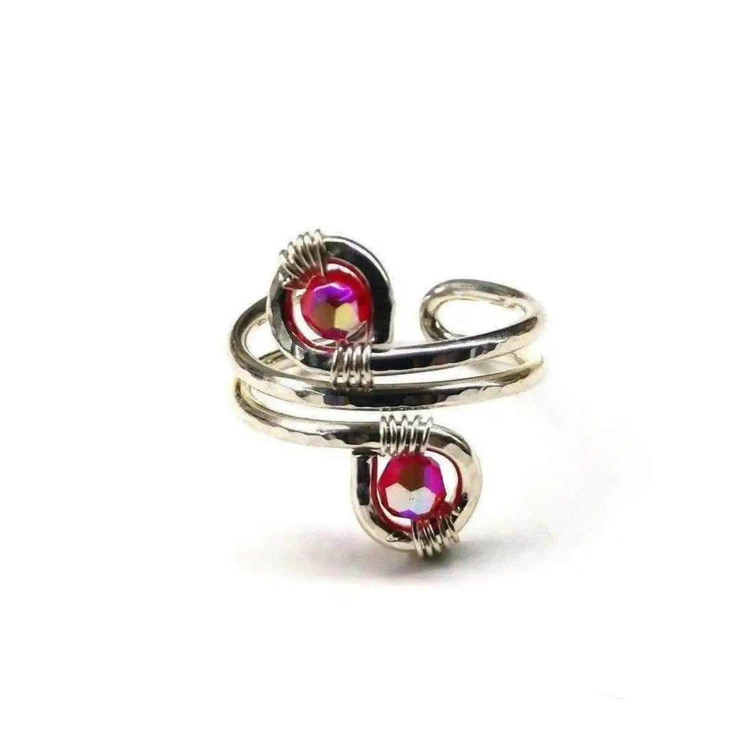 Handmade adjustable rings for women featuring silver and red gemstones in a unique design.