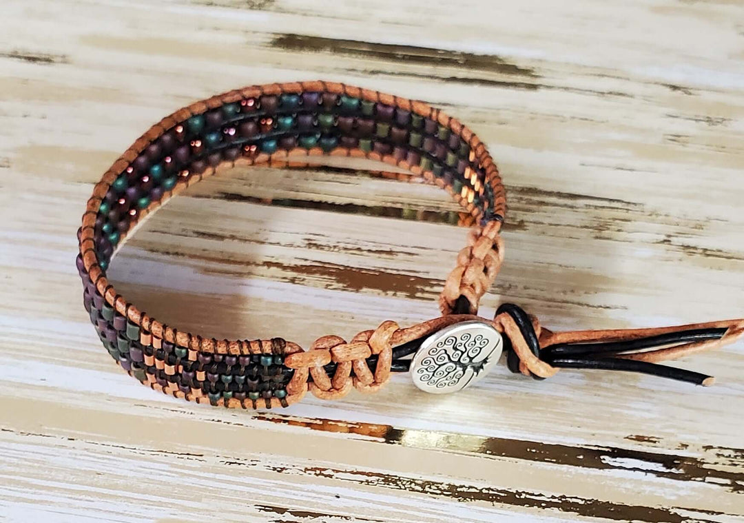 Intricate Beaded Woven Leather Bracelets featuring a flower design with crystals and handcrafted details.