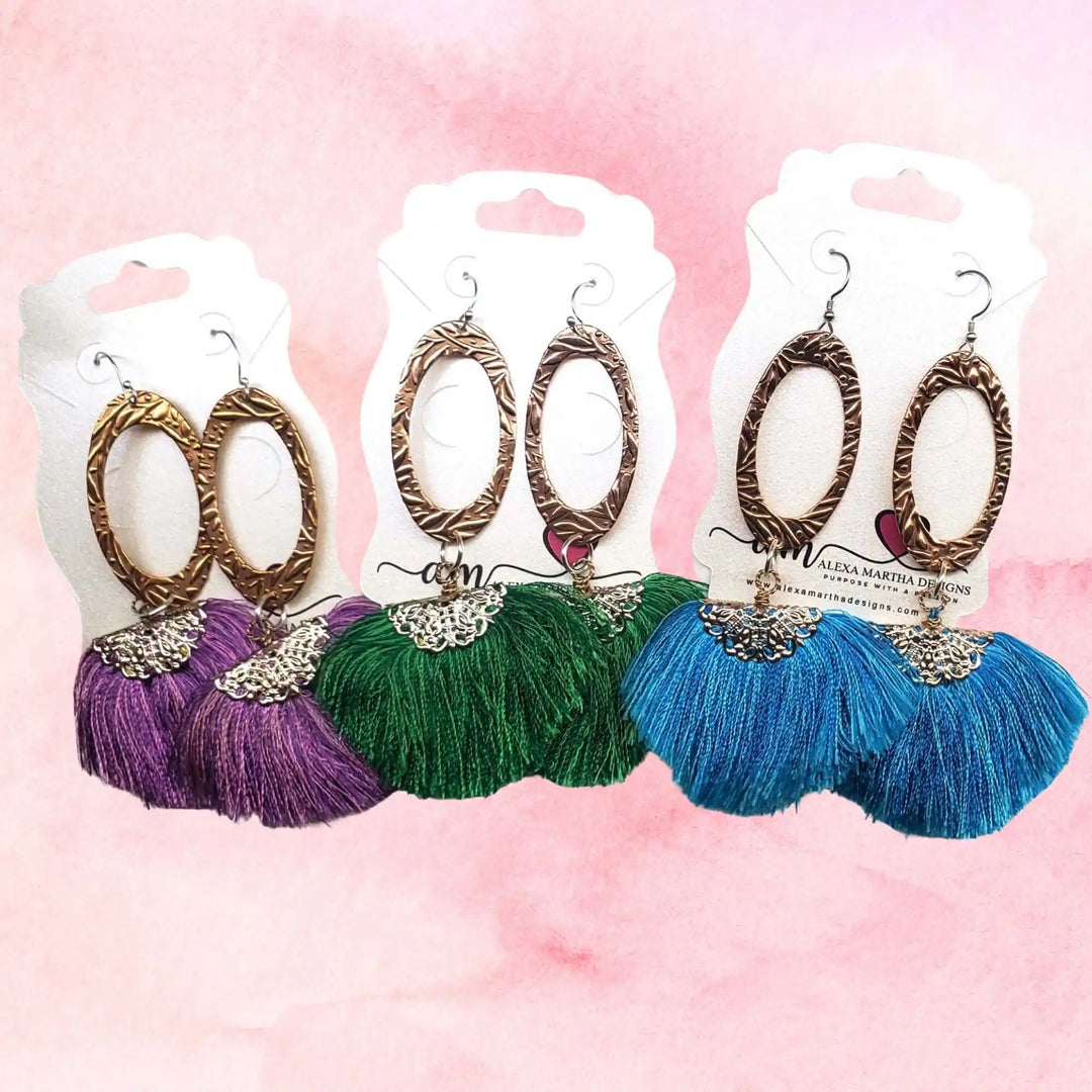 Fan Tassel Handmade Jewelry collection featuring colorful tassel earrings in purple, green, and blue with metal accents.