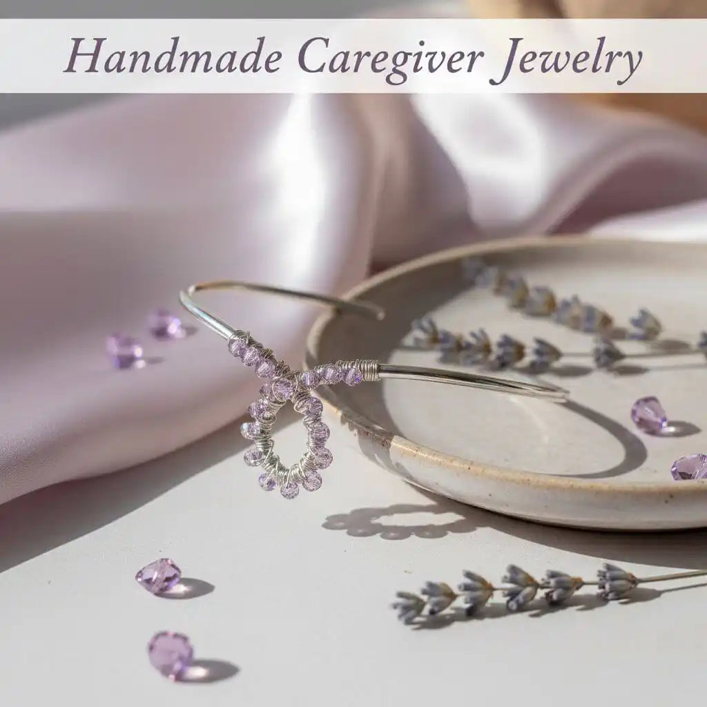 Handmade Awareness Jewelry for Caregivers displayed with lavender accents and elegant design on a soft fabric background.