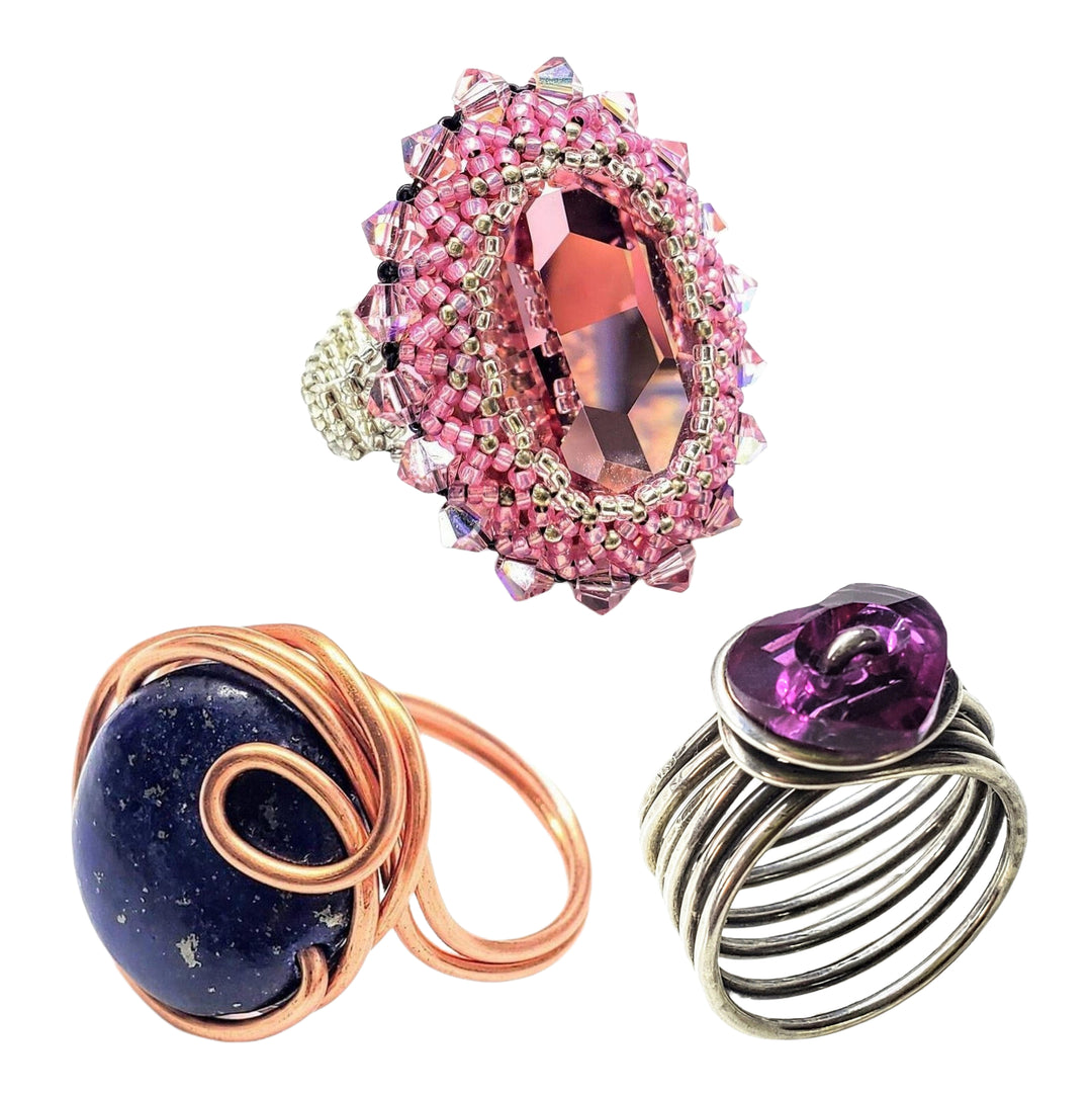 A Variety of handmade Crystal and gemstone siver and copper rings. -Alexa Martha Designs