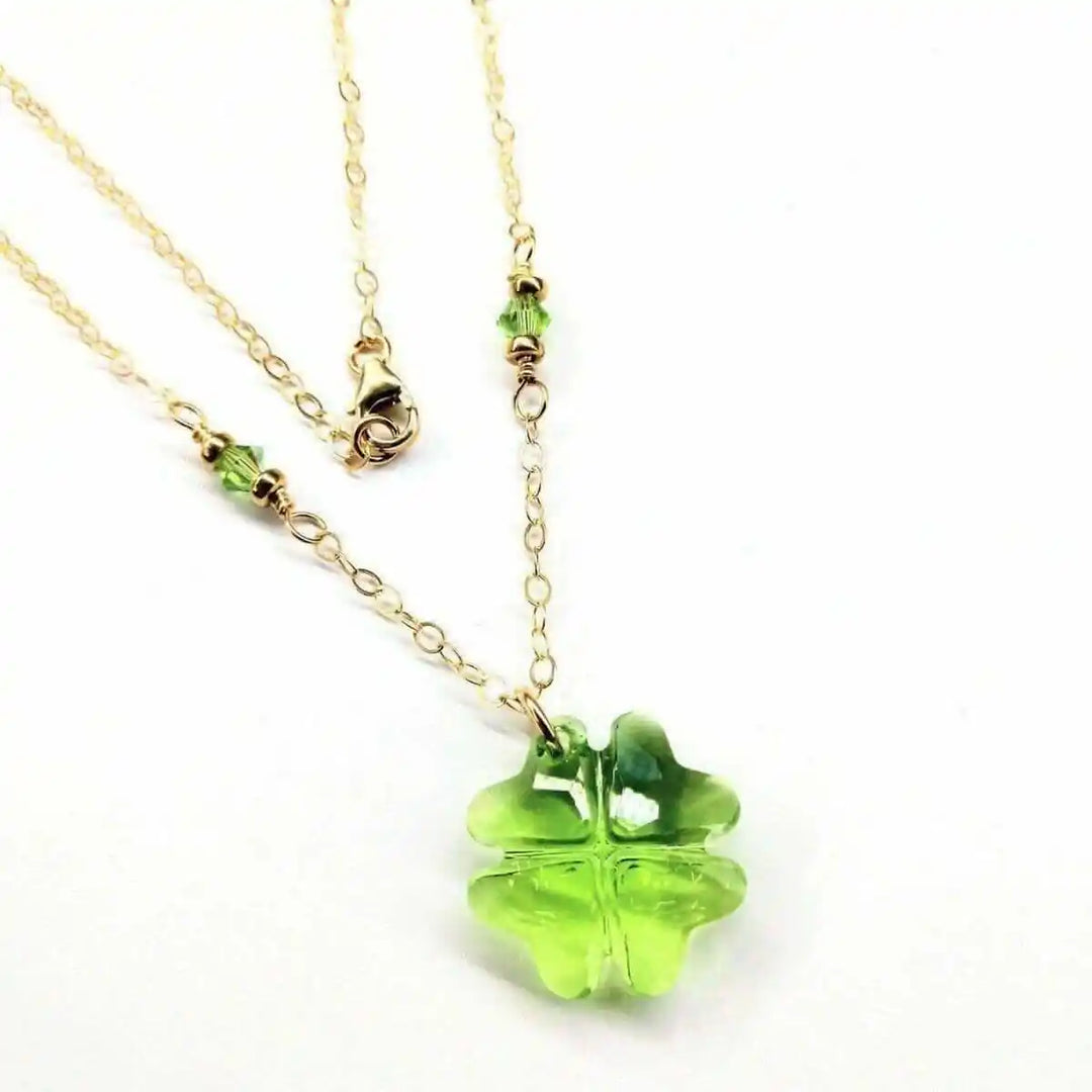 14 K Gold Filled Light Green Crystal Clover Necklace featuring a Peridot-colored Swarovski Crystal and gold chain.