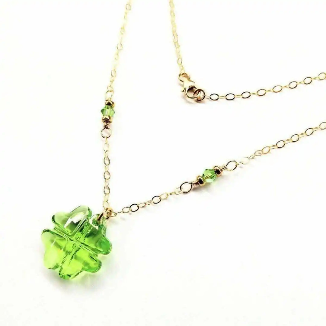 14 K Gold Filled Light Green Crystal Clover Necklace featuring a Peridot-colored Swarovski Crystal and delicate gold chain.