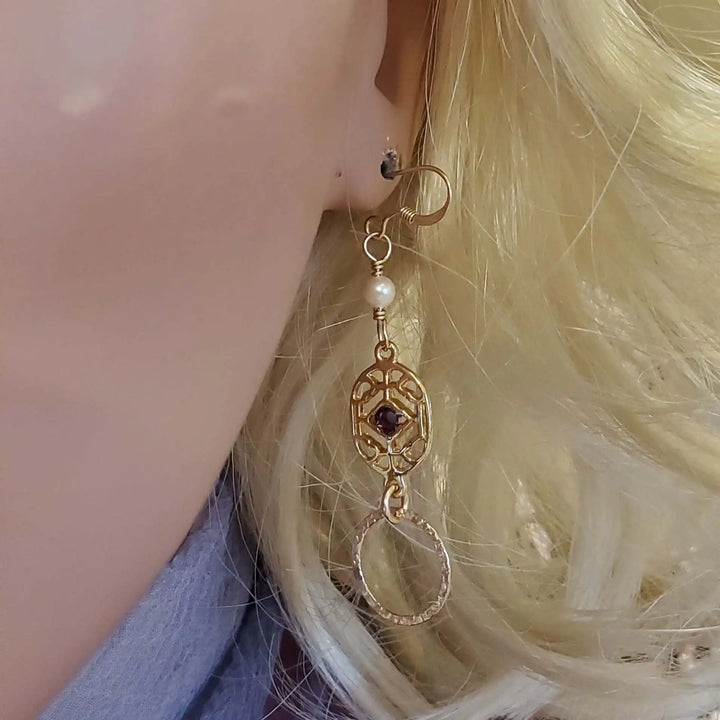 14 K Gold Filled Purple Crystal Circle Filigree Earrings worn on a mannequin model.