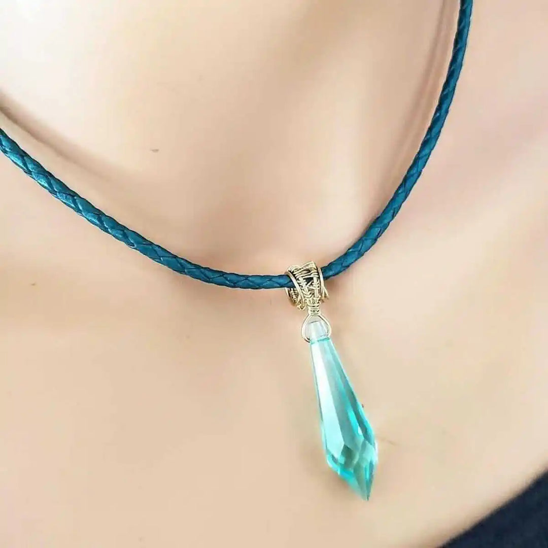 Gold Filled Aqua Crystal Choker Necklace featuring a turquoise braided cord and a stunning aqua crystal pendant.