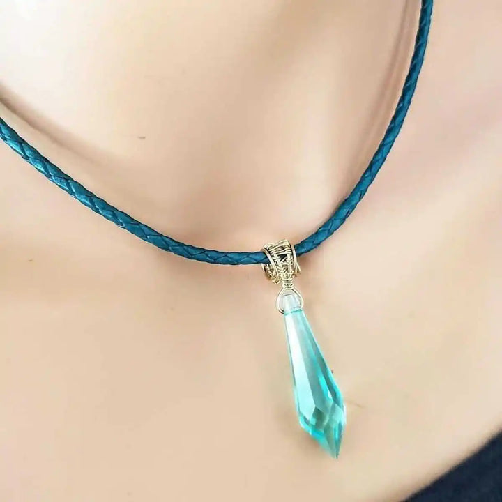 Gold Filled Aqua Crystal Choker Necklace featuring a turquoise braided cord and a stunning aqua crystal pendant.