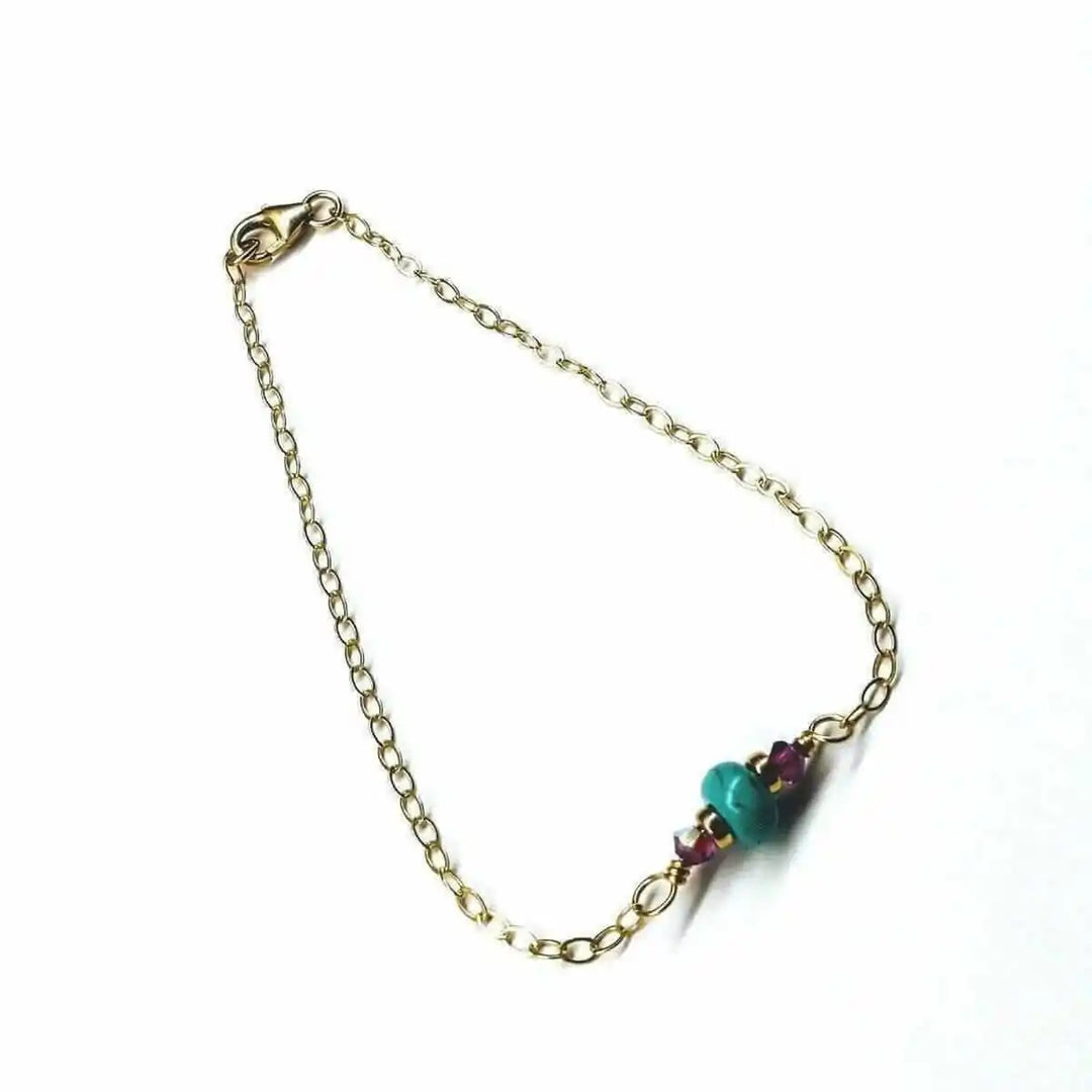 14K Gold Filled Pink and Turquoise Gemstone Dainty Bracelet showcasing vibrant gemstones on a delicate gold chain.