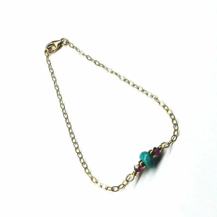 14K Gold Filled Pink and Turquoise Gemstone Dainty Bracelet showcasing vibrant gemstones on a delicate gold chain.