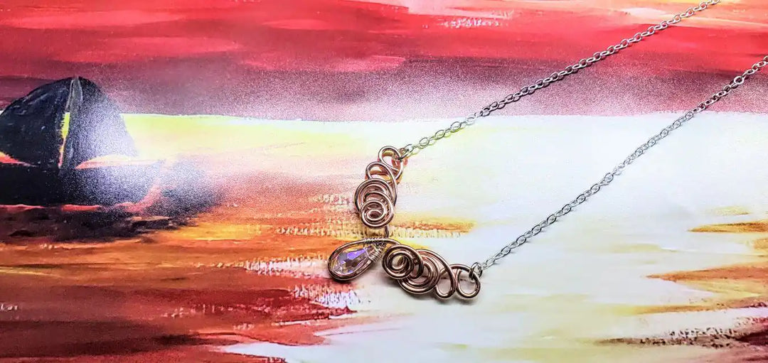 Handmade Sculpted Copper Silver Angel in Flight Necklace showcasing intricate design against a vibrant background.