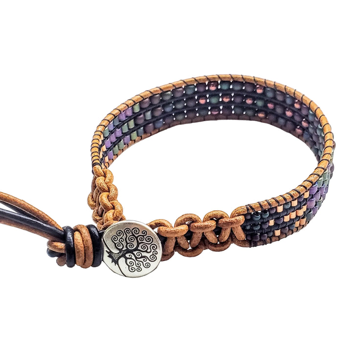 Multicolored beaded bracelet with a metal clasp on a white background
