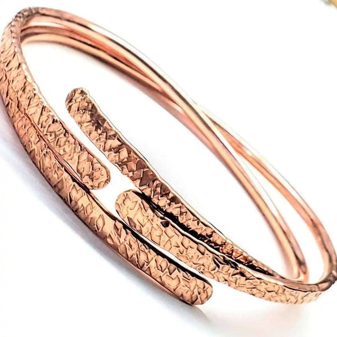Unisex 8 Gauge Adjustable Hammered Copper Overlap Bangle showcasing bold metalsmith artistry and intricate design.