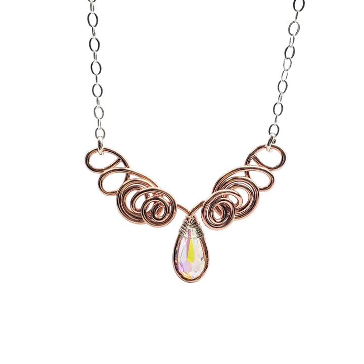 Copper wire necklace with a teardrop-shaped pendant on a white background