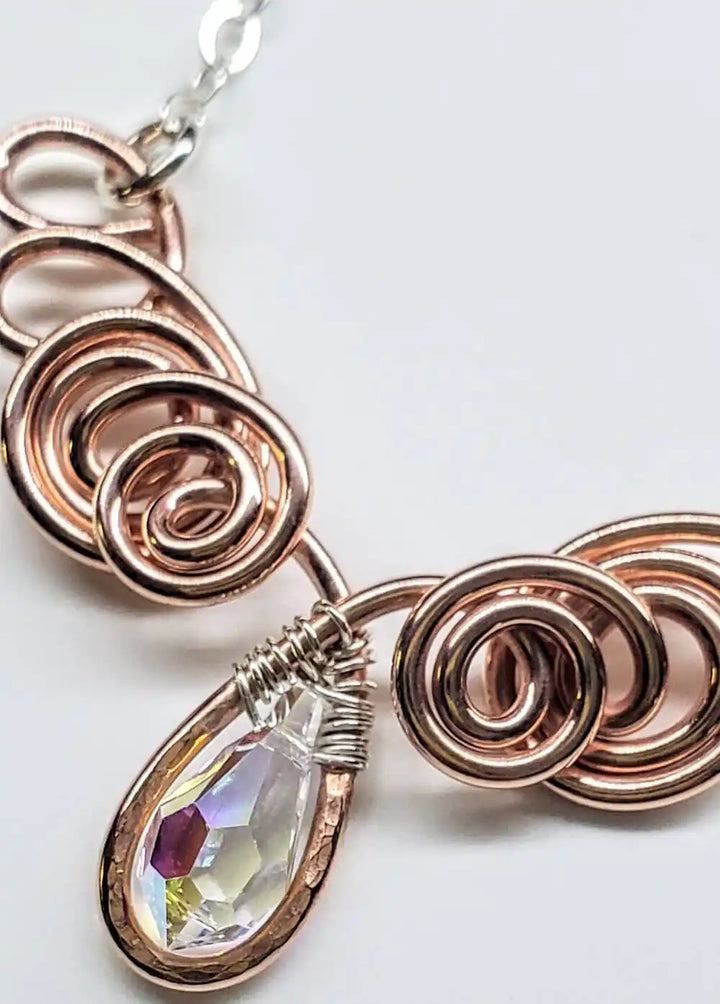 Handmade Sculpted Copper Silver Angel in Flight Necklace featuring intricate wire spirals and a beautiful teardrop crystal.