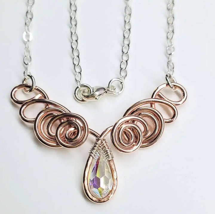 Handmade Sculpted Copper Silver Angel in Flight Necklace featuring elegant wire design and a sparkling crystal pendant.