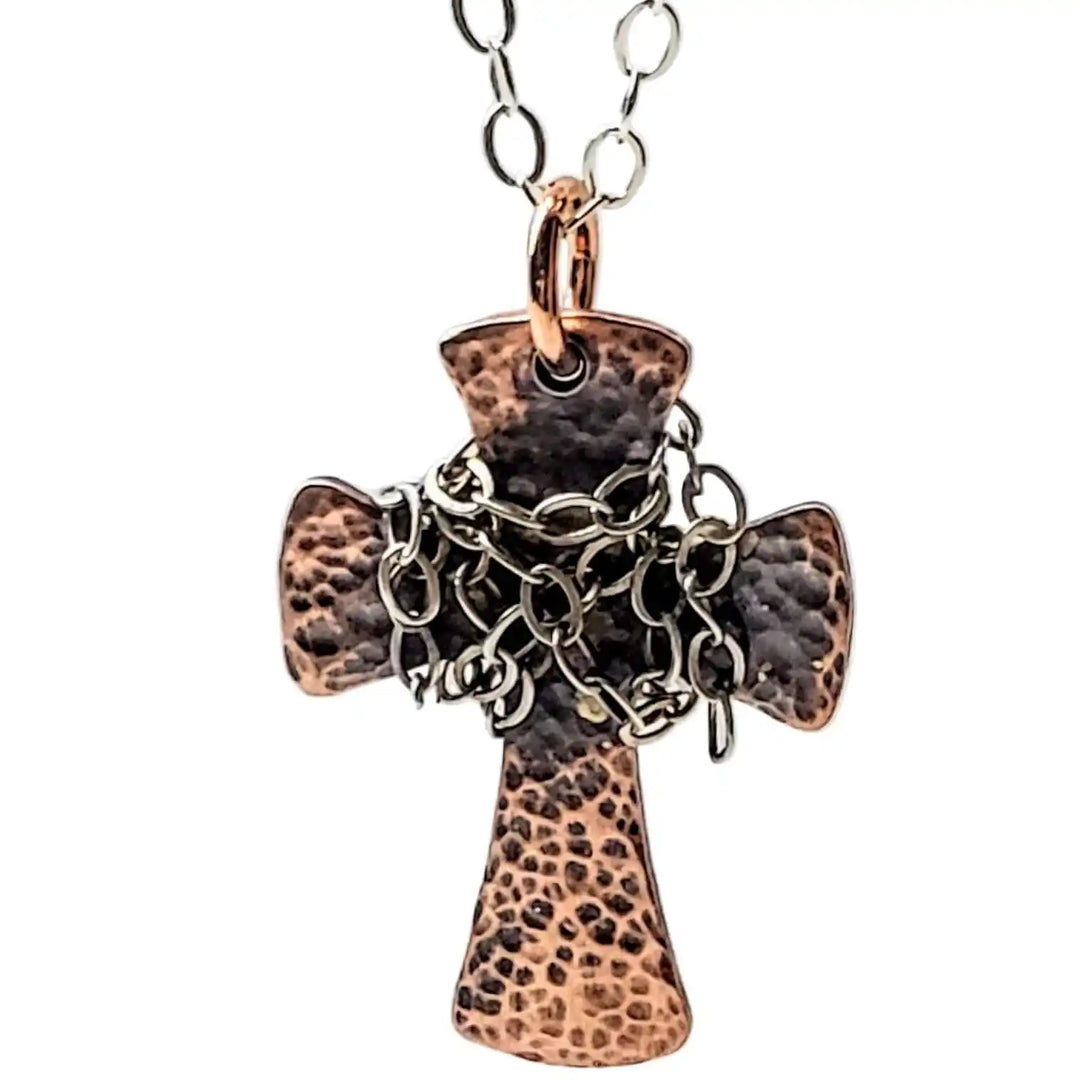 Chained Hammered Copper Cross Necklace For Him Or Her showcasing a unique hand-hammered design with intricate chain accents.