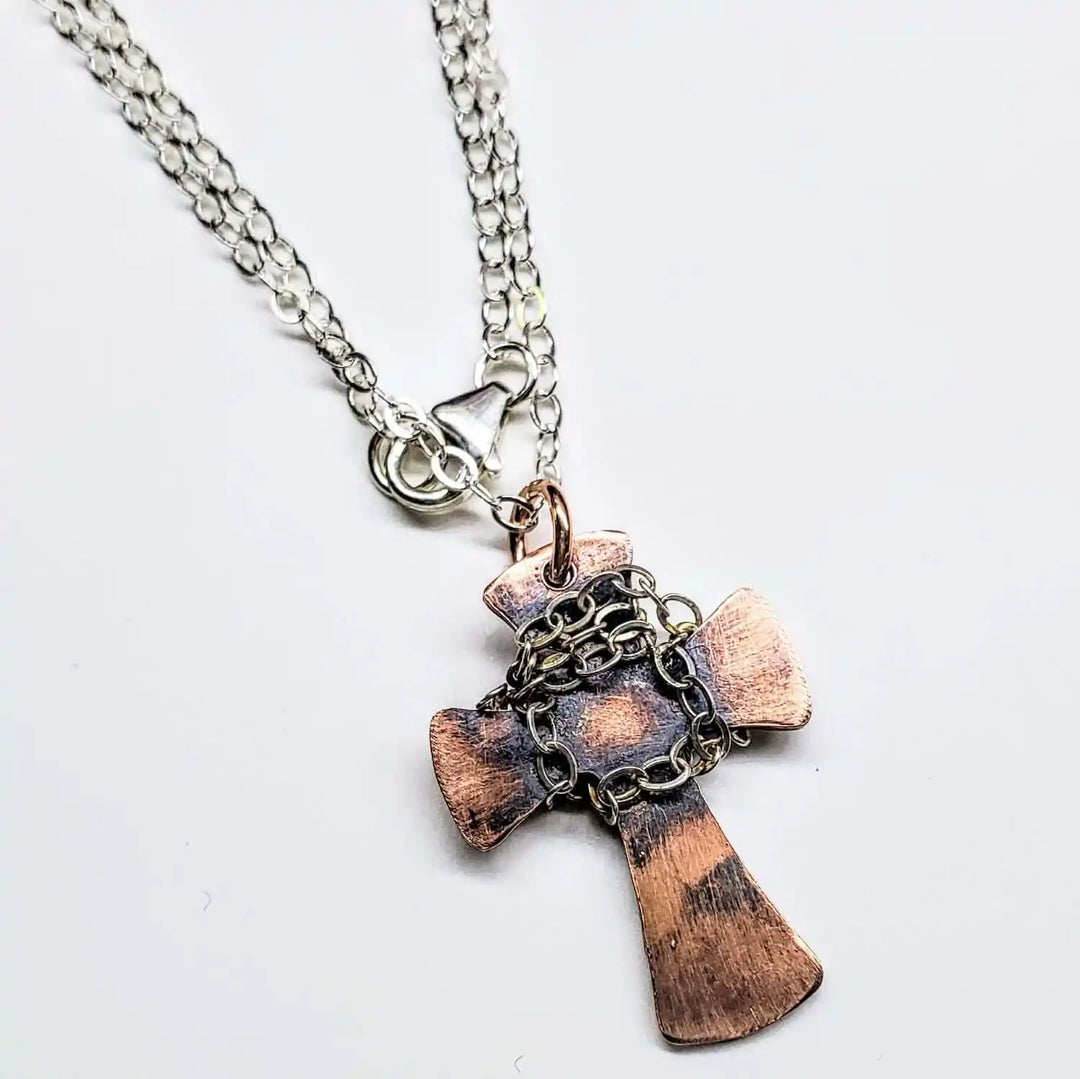 Chained Hammered Copper Cross Necklace For Him Or Her showcasing a unique copper cross pendant with chain accents.