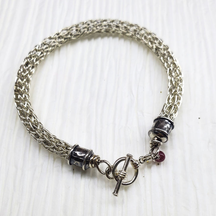 Handmade 10mm sterling silver Viking knit bracelet with Burma Ruby charm - Bracelet - Alexa Martha Designs   