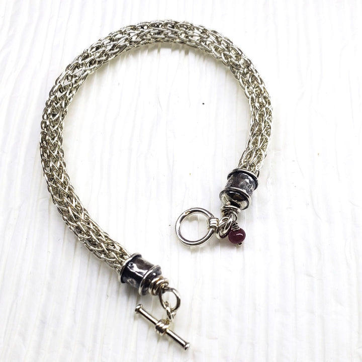 Handmade 10mm sterling silver Viking knit bracelet with Burma Ruby charm - Bracelet - Alexa Martha Designs   