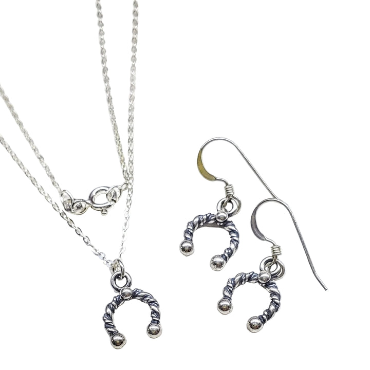Handmade sterling silver horseshoe jewelry set, featuring necklace and earrings, perfect for good fortune and elegance.