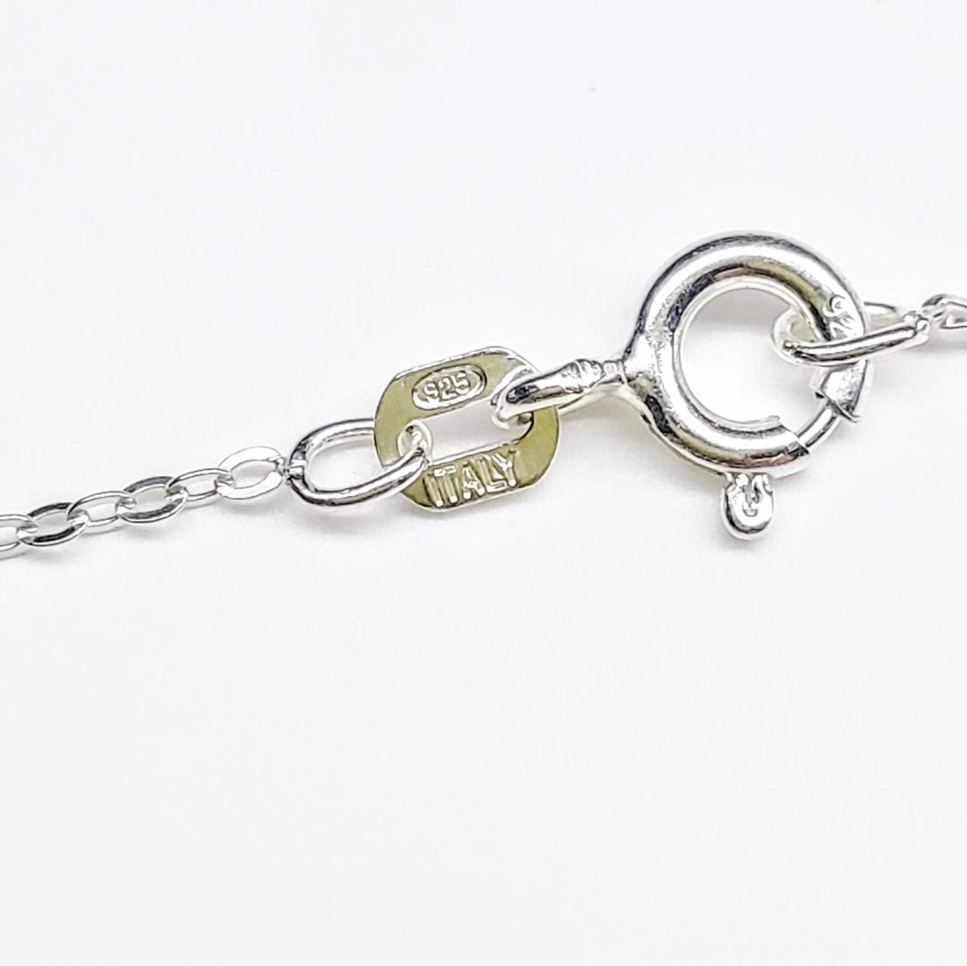 Close-up of the clasp and chain on handmade sterling silver horseshoe jewelry, showcasing craftsmanship and authenticity.