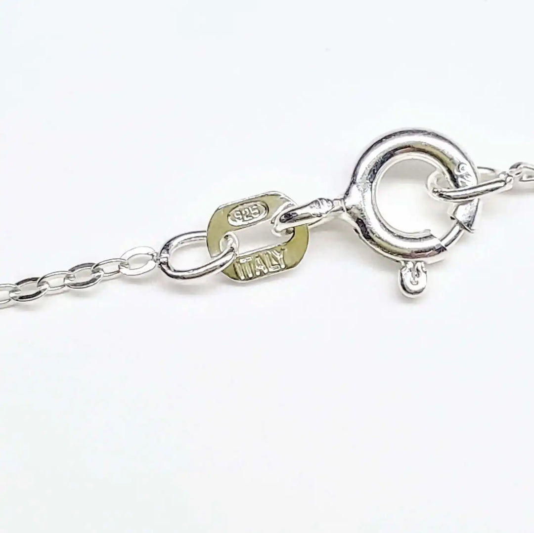 Close-up of the clasp and chain on handmade sterling silver horseshoe jewelry, showcasing craftsmanship and authenticity.