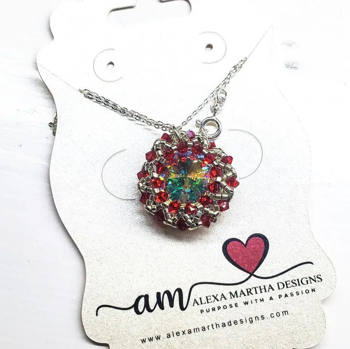 Beaded Super Sparkly Swarovski Rosette Star Pendant Necklace showcased on a display card with a silver chain.