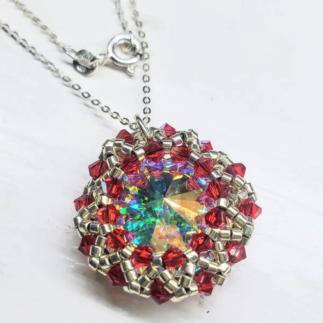 Beaded Super Sparkly Swarovski Rosette Star Pendant Necklace showcasing a colorful crystal centerpiece surrounded by red beads.