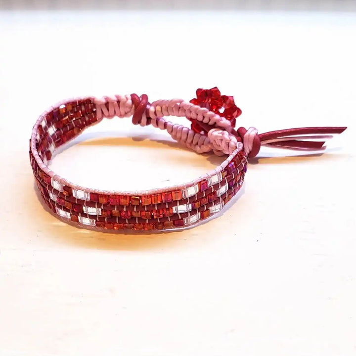 Leather Silk Bead Woven Crystal Button Bracelet featuring red leather and pink silk with sparkling beads.
