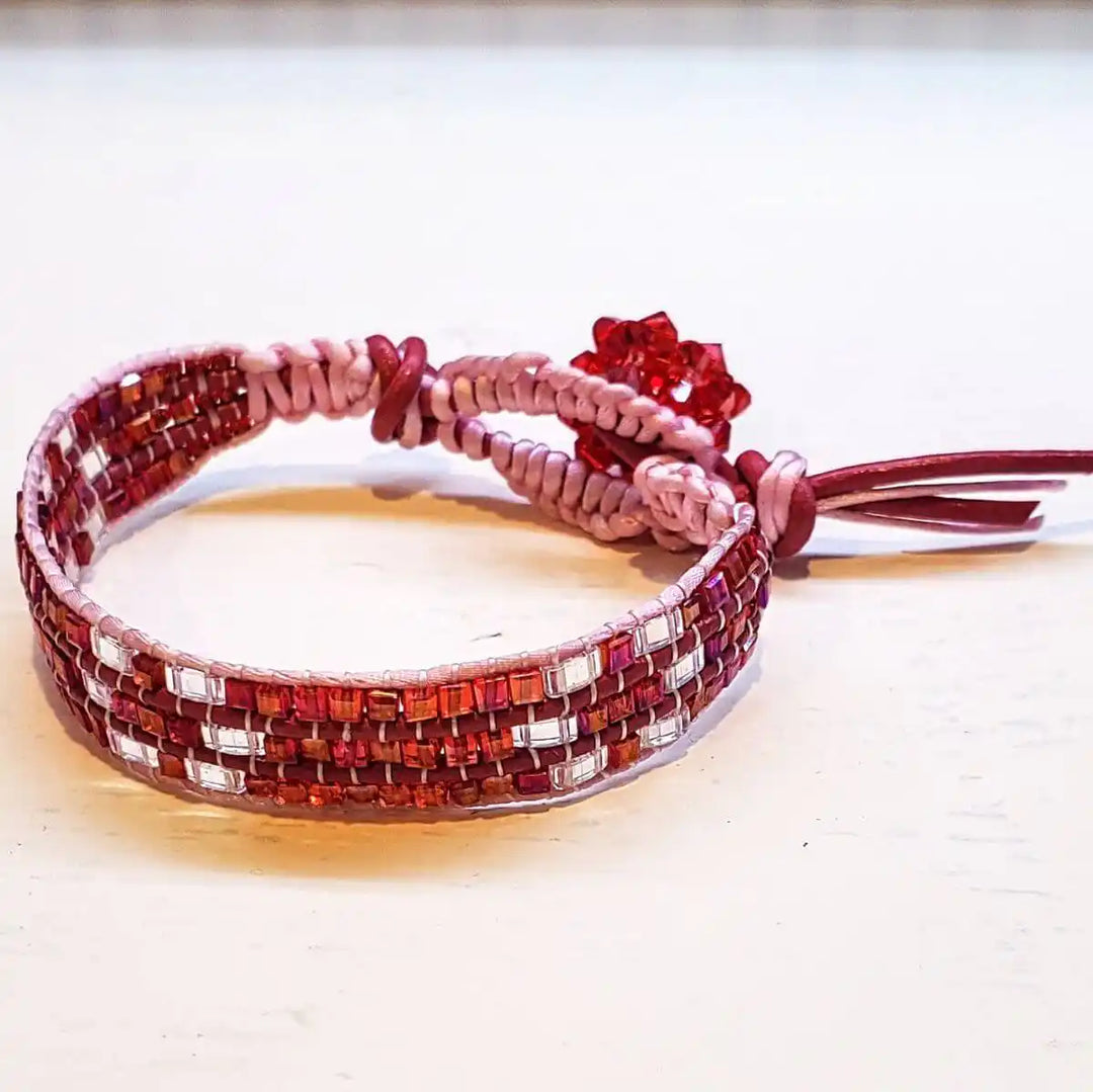 Leather Silk Bead Woven Crystal Button Bracelet featuring red leather and pink silk with sparkling crystals.