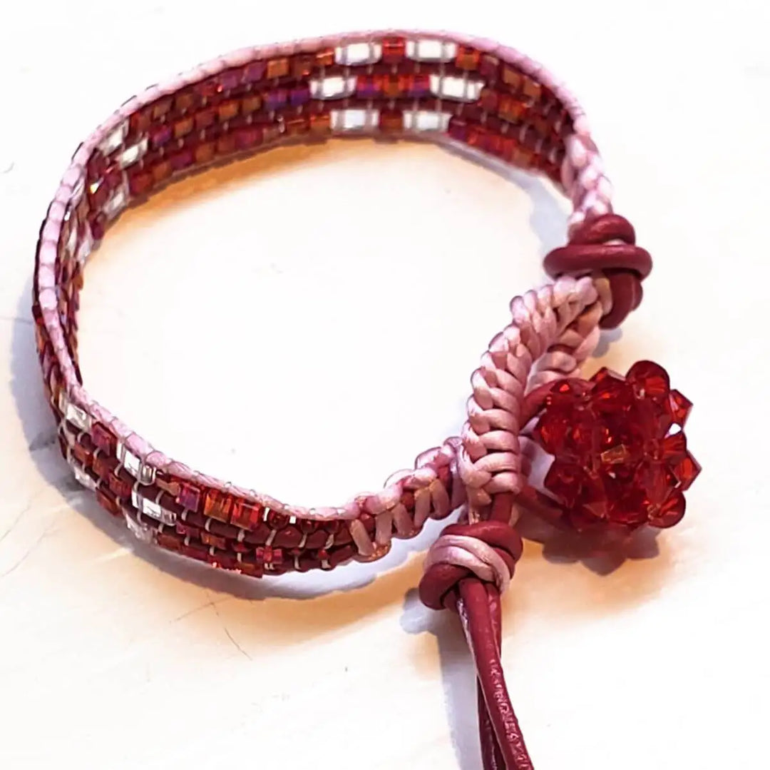 Leather Silk Bead Woven Crystal Button Bracelet with intricate bead-weaving and a red crystal button detail.