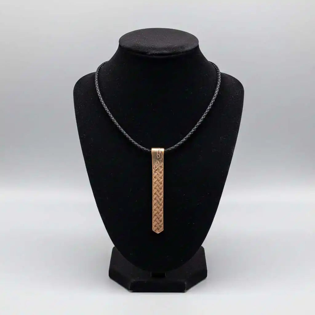 Copper Weave Embossed Necktie Necklace displayed on a black bust showcasing its unique design.