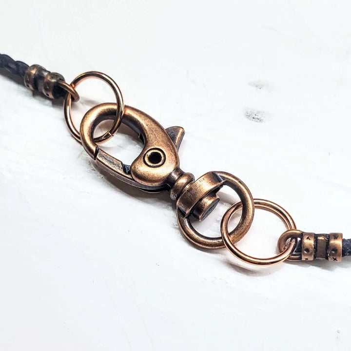Copper Weave Embossed Necktie Necklace clasp with bronze hardware and intricate design details.