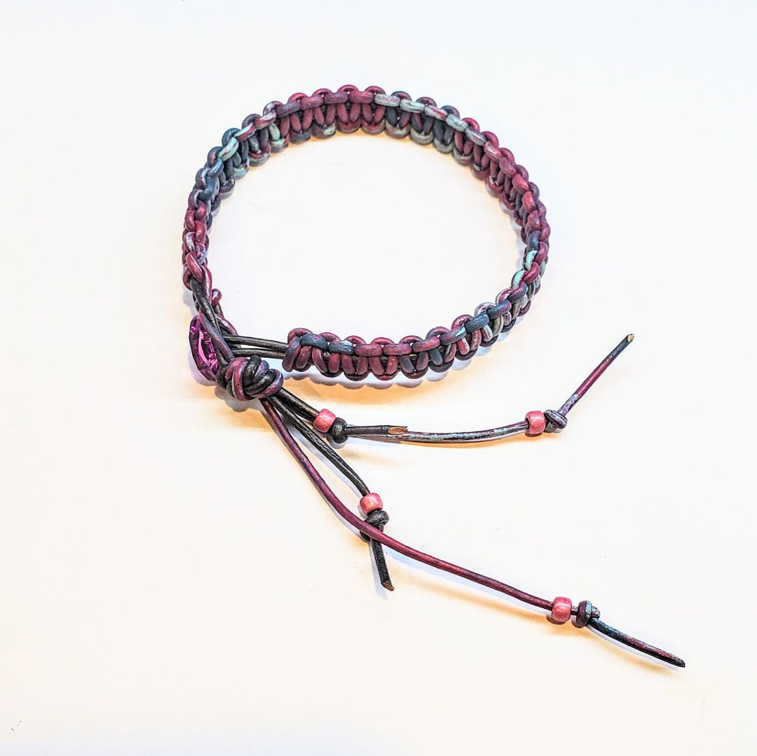 Macrame tie-dye leather Crystal bracelet featuring vibrant pink, blue, and black hand-dyed leather and macramé design.