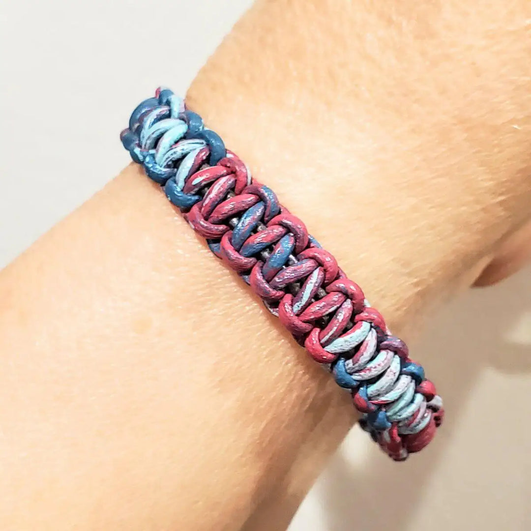 Macrame tie-dye leather Crystal bracelet displayed on a wrist, featuring vibrant pink and blue colors in a unique design.