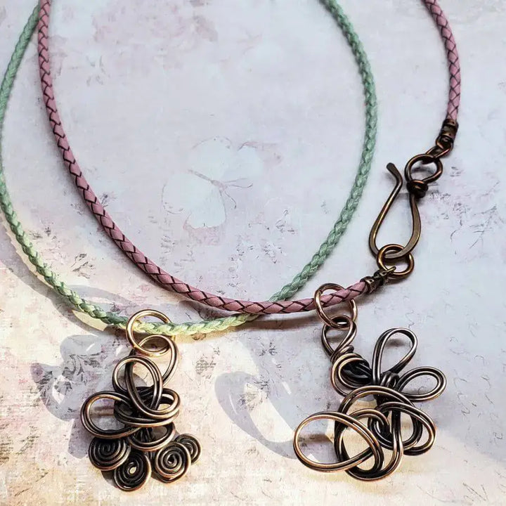Reversible Interchangeable Copper Wire Sculpted Necklaces with unique designs in pink and green braided cords.
