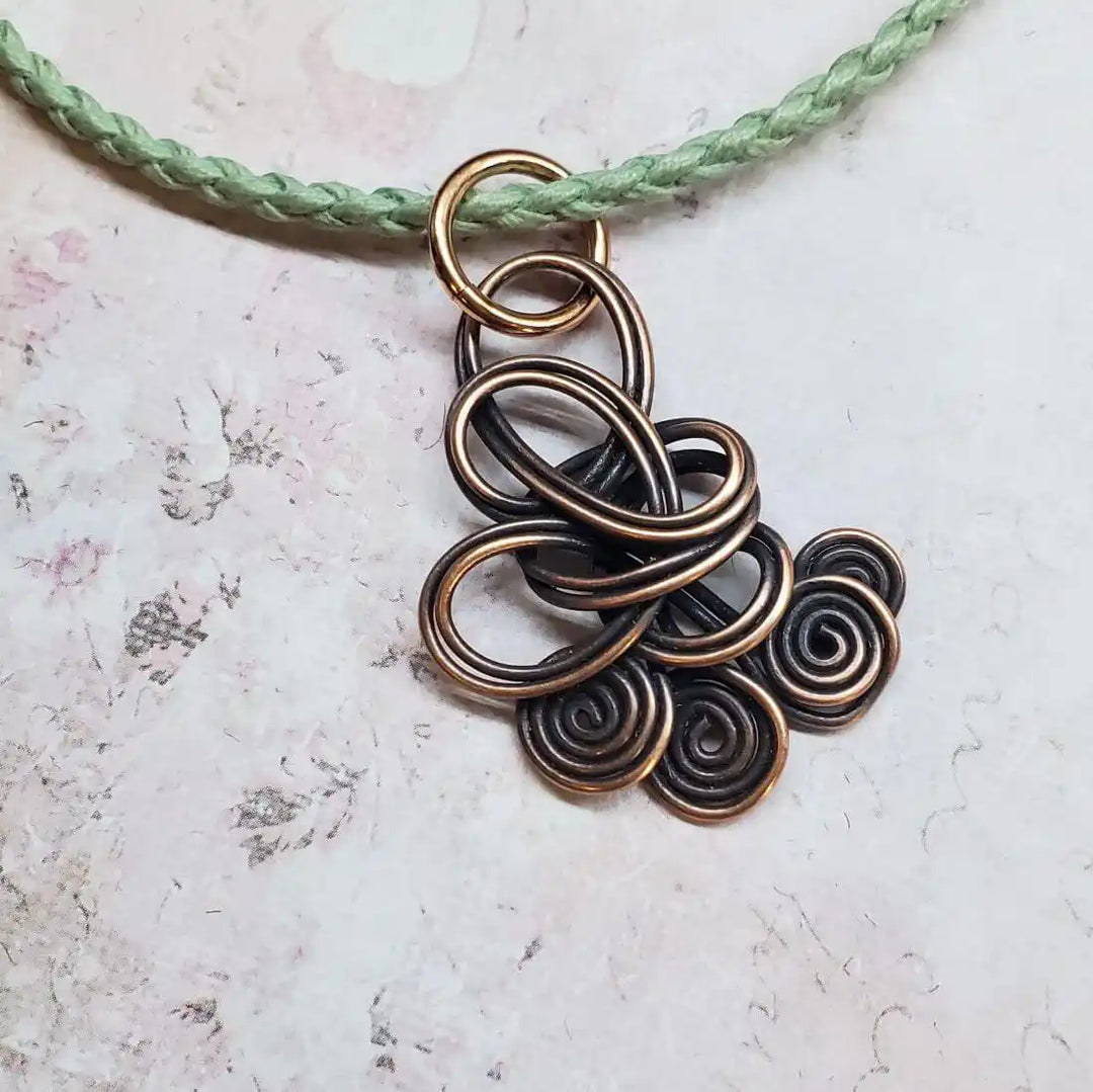 Reversible Interchangeable Copper Wire Sculpted Necklaces featuring unique, handmade copper design with spirals and loops.
