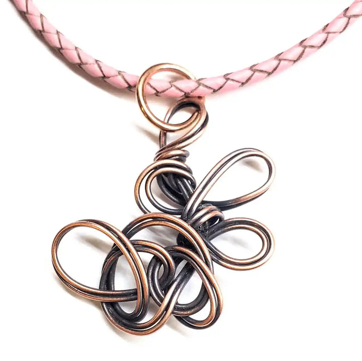 Reversible Interchangeable Copper Wire Sculpted Necklaces featuring a handmade organic design with a pink braided cord.