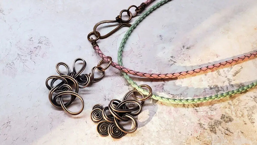 Reversible Interchangeable Copper Wire Sculpted Necklaces featuring intricate designs and braided cords.
