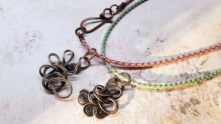 Reversible Interchangeable Copper Wire Sculpted Necklaces featuring intricate designs and braided cords.