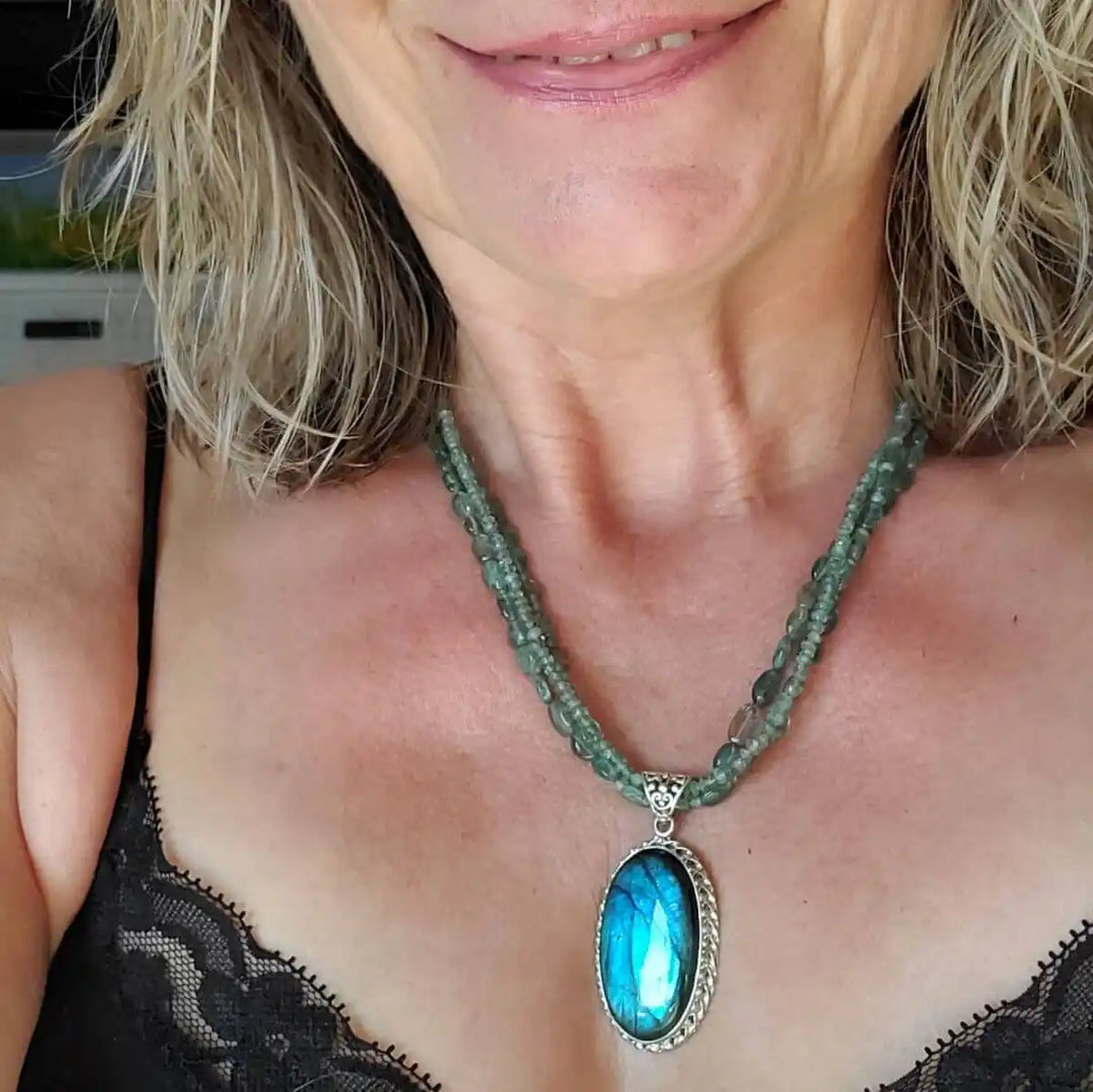 Multi Strand Blue Green Silver Bezel Labradorite Necklace worn by a woman, highlighting the vibrant labradorite and elegant craftsmanship.