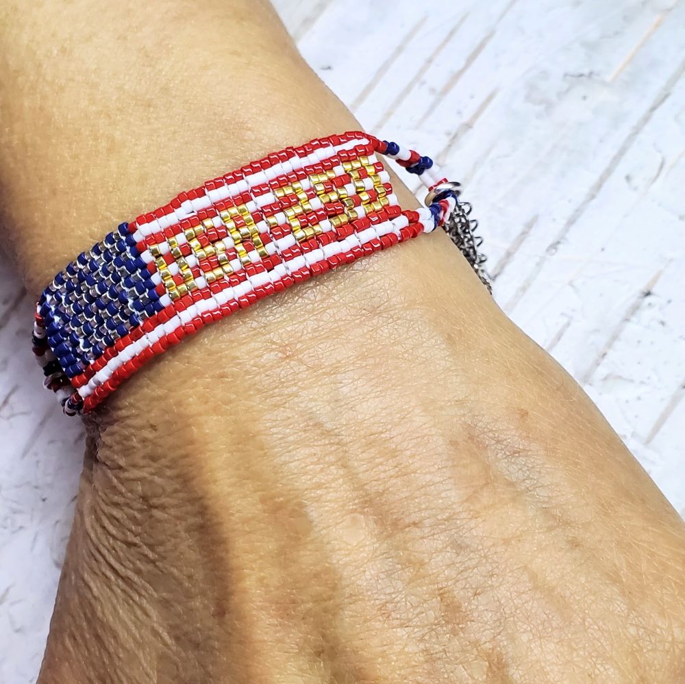 USA 250th Anniversary Beaded Bracelet By Alexa Martha showcased on a wrist, highlighting its vibrant colors and beadwork.