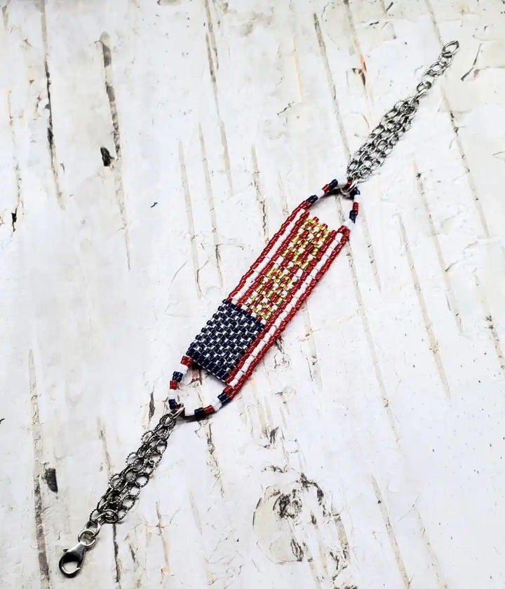 USA 250th Anniversary Beaded Bracelet By Alexa Martha showcasing intricate beadwork with red, white, and blue design.