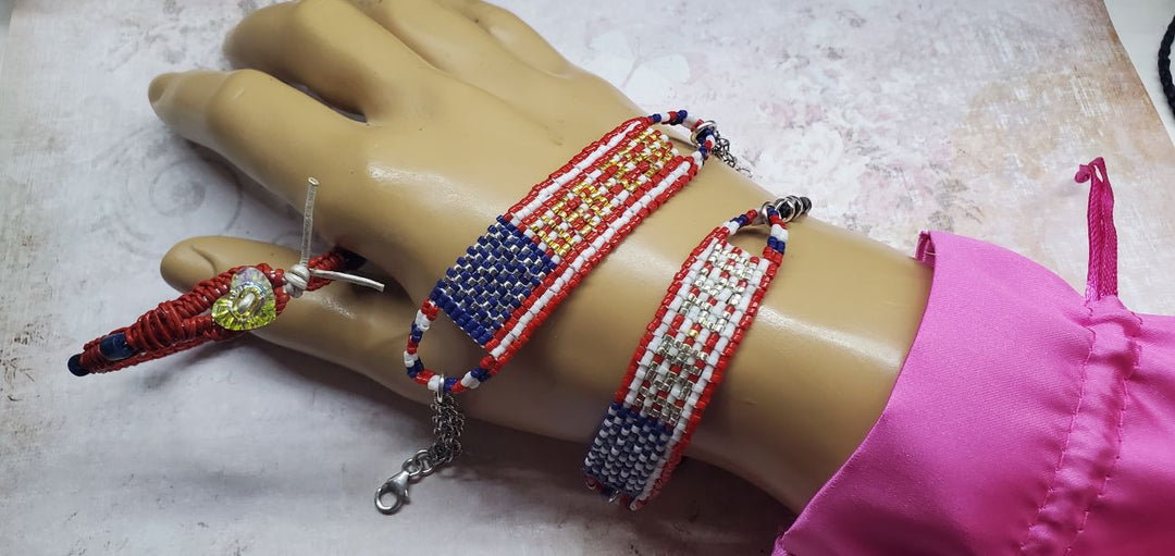 USA 250th Anniversary Beaded Bracelet By Alexa Martha displayed on a mannequin hand, showcasing its intricate beadwork.