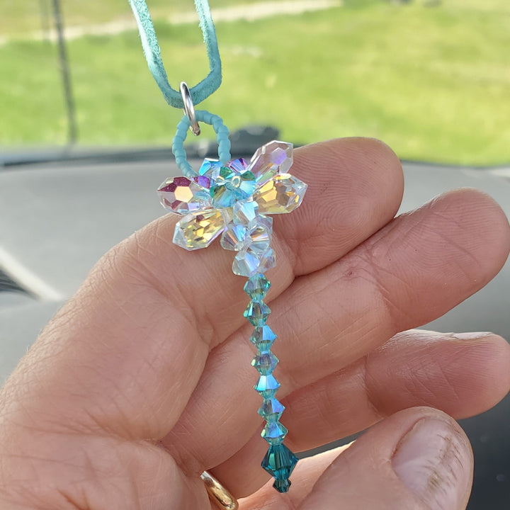 Beaded 3-D Rearview Mirror Colored Crystal Dragonfly Charm held in hand with colorful crystals and bead details.